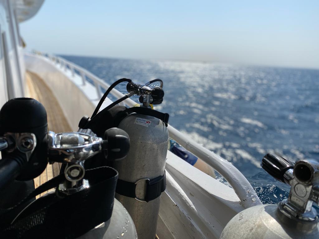 A creative photo of the red sea and a diving tank in the chloes diving center boat