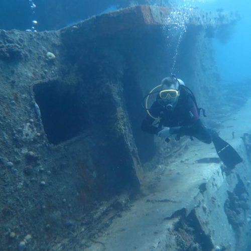 A photo of a solo diver with the el minya wreck taking the divemaster course with chloes diving center in hurghada